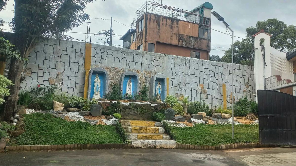 Stone grotto exterior with religious statues