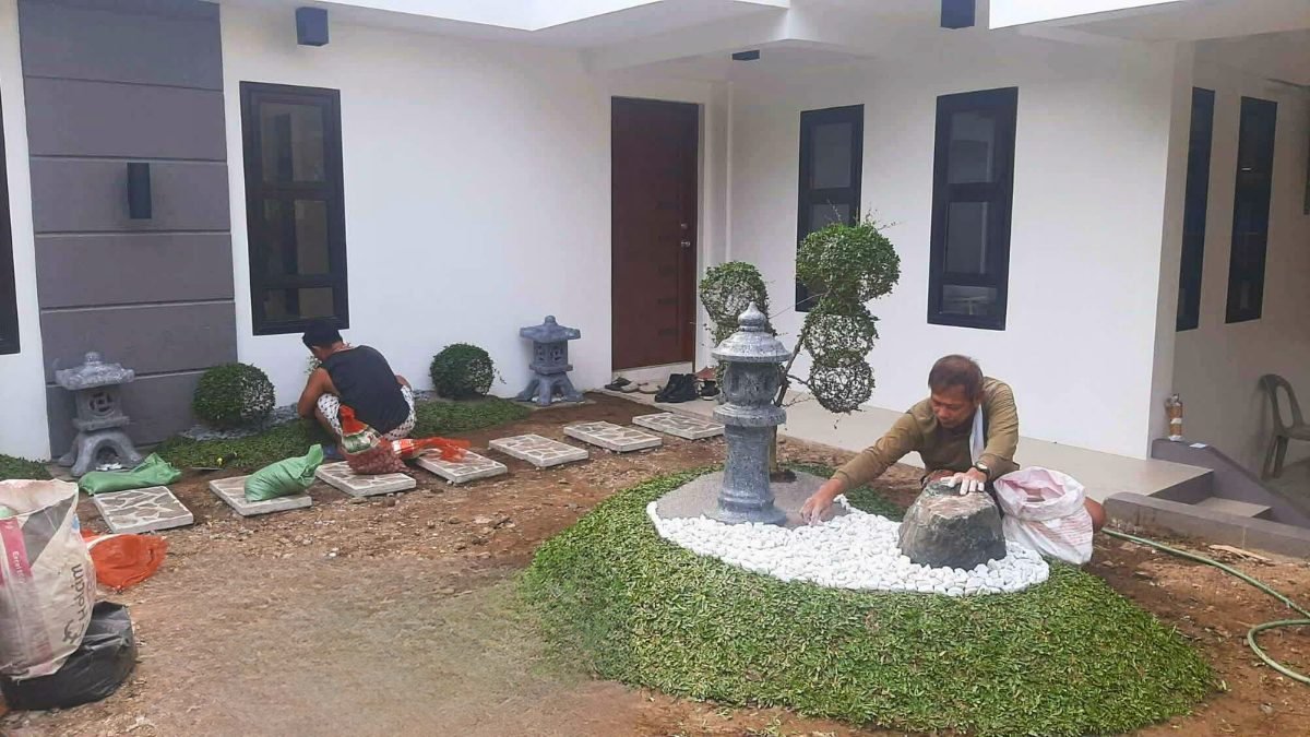 Workers installing landscape elements