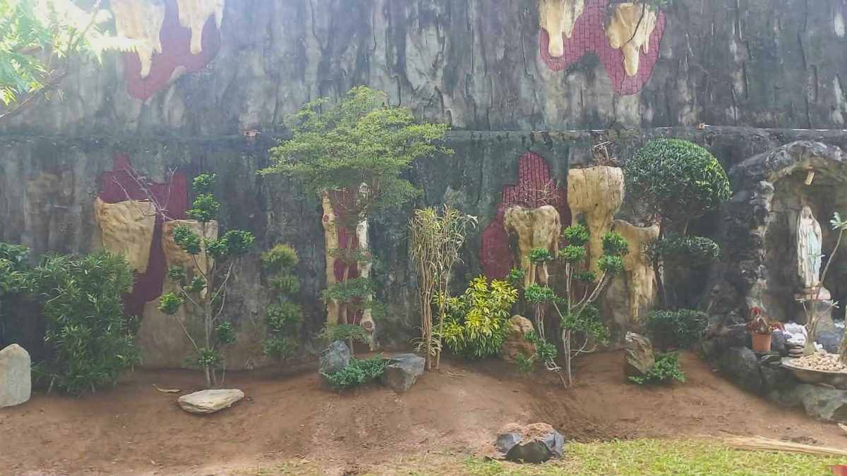 Large stone grotto with landscaping